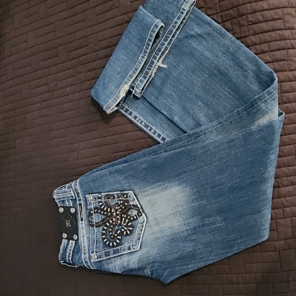Miss Me fleur-de-lis jeans.